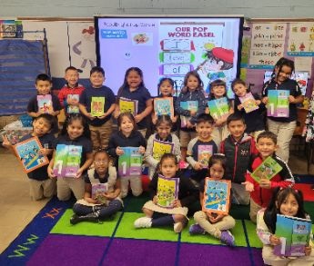 Students with their Read Bright Workbooks